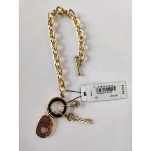 Guess goldtone Toggle charm bracelet NOS NWT 6 3/4"-7" Key, Logo, Bling Charms